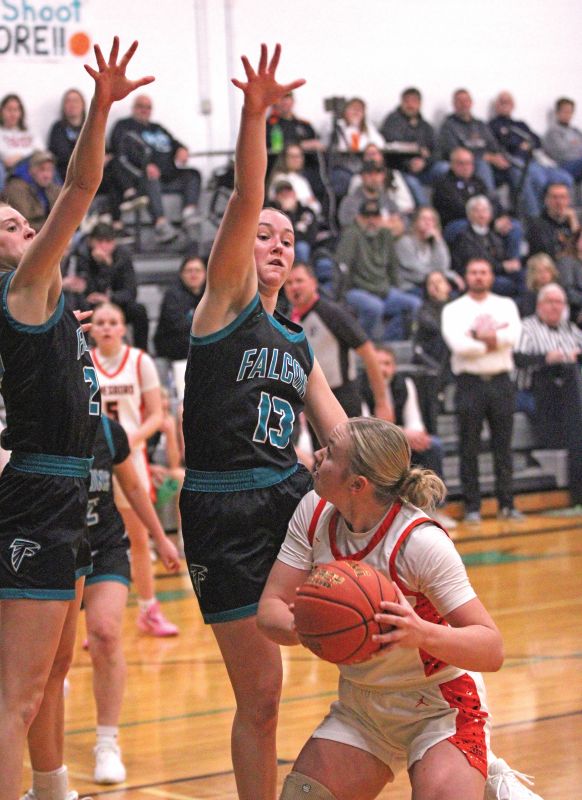 Lanesboro’s Jensyn Storhoff sees arms, of Fillmore Central’s Kyla Hellickson (#13) and Cora Britton. FC won the contest 62-38. Photo by Paul Trende