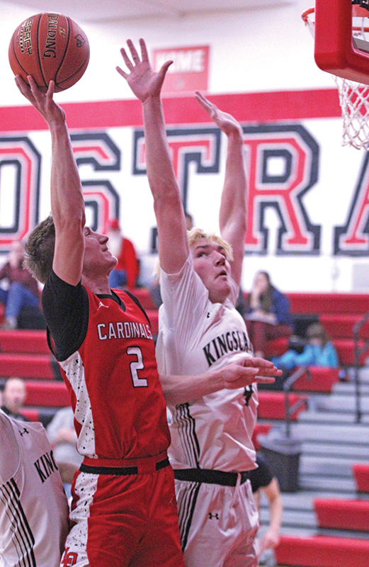 Kingsland’s Dalton Bamlet tries to deny LeRoy-Ostrander’s Reid Hungerholt at the rack in the teams’ SEC matchup won by the Knights 54-44. It was their first win. Photo by Paul Trende
