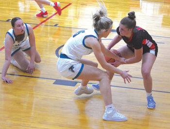 Spring Grove/Mabel-Canton’s Izabel Kaufmann tries to protect the ball from the steal by Fillmore Central’s Hannah Vaalemoen in the Lions 48-34 non-conference win. Photo by Lee Epps