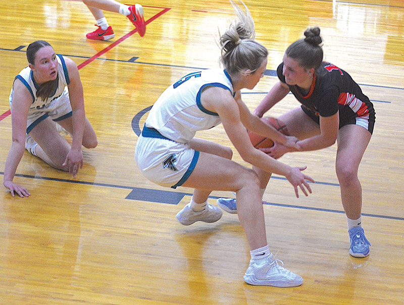 Spring Grove/Mabel-Canton’s Izabel Kaufmann tries to protect the ball from the steal by Fillmore Central’s Hannah Vaalemoen in the Lions 48-34 non-conference win. Photo by Lee Epps