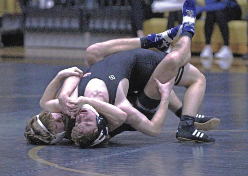 FCLMC’s August Pfeffer has Caledonia/Houston’s Trevin Meyers in a tough spot at the Warriors’ triangular. Pfeffer won the above match 16-0. Photo by Paul Trende