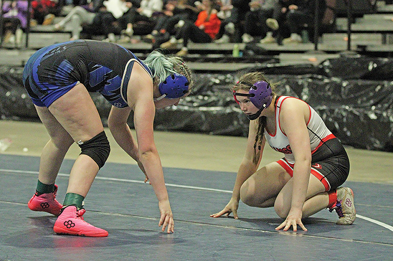 GMLOS’ Brandy Christenson locks in on her opponent Zoey Bailey of Eastview in a Section 2 155-pound true second match. Christenson went 5-1 for the tourney including winning the above bout by 14-3 major to earn her second state qualification (2024). Photo by Paul Trende