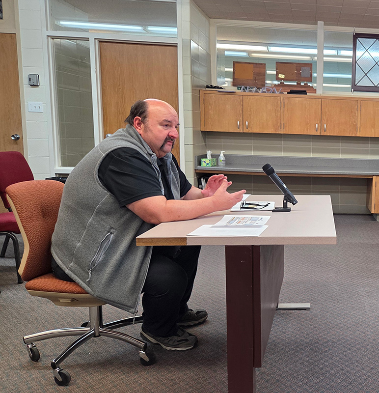 Bill Spitzer of Rolling Hills Transit addresses the Harmony council. Photo by Hannah Wingert