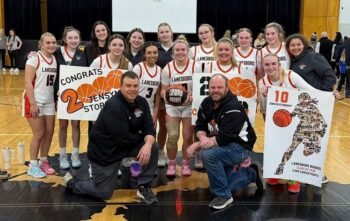Lanesboro senior guard Jensyn Storhoff poses with teammates and her coaches including dad Steve, left front, after surpassing 2,000 career points. She is Lanesboro’s all-time leading scorer, boys or girls. Photo submitted