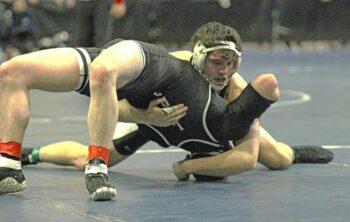 FCLMC’s top-ranked Kane Larson gets back points on LARP’s 6th-ranked Zach Plank in a 189-pound section finals match. Larson won the match by 17-1 tech fall for his third state berth. Each athlete qualified for state. Photo by Paul Trende