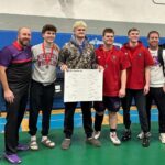 GMLOS coaches Jackson Hale and Randy Smith (left and left), Grant Lunning and Clayton Luthe (right and right) pose with the Bulldogs’ four state qualifiers (middle) Cael Smith, Drake Payne (bracket), Wyatt Krull and Parker Armagost. Smith notably requalified while Payne won the 215-pound section title. Photo by Randy Smith
