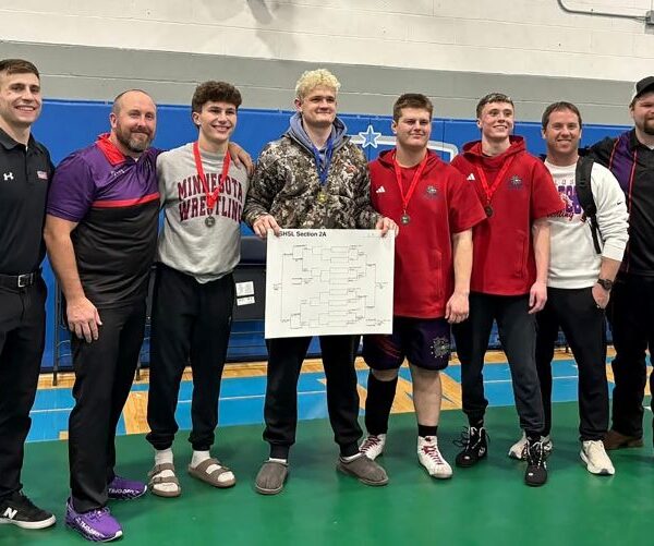 GMLOS coaches Jackson Hale and Randy Smith (left and left), Grant Lunning and Clayton Luthe (right and right) pose with the Bulldogs’ four state qualifiers (middle) Cael Smith, Drake Payne (bracket), Wyatt Krull and Parker Armagost. Smith notably requalified while Payne won the 215-pound section title. Photo by Randy Smith