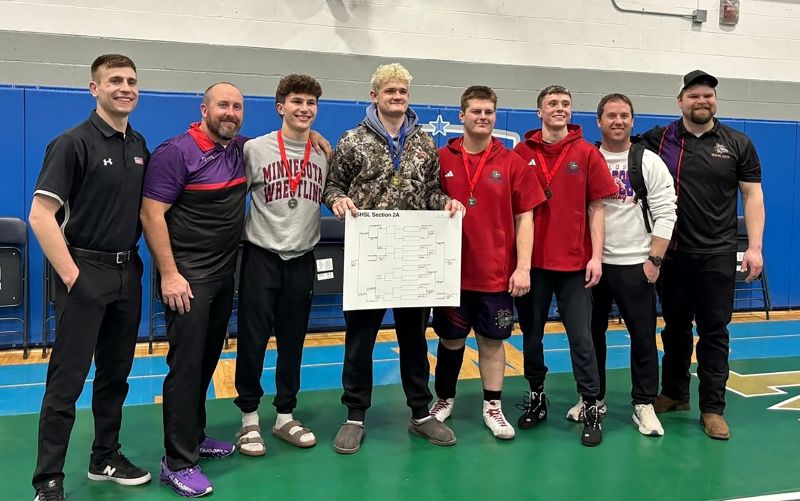 GMLOS coaches Jackson Hale and Randy Smith (left and left), Grant Lunning and Clayton Luthe (right and right) pose with the Bulldogs’ four state qualifiers (middle) Cael Smith, Drake Payne (bracket), Wyatt Krull and Parker Armagost. Smith notably requalified while Payne won the 215-pound section title. Photo by Randy Smith