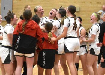 Houston players celebrate after notching their best win of the year. The Hurricanes beat SEC leading Spring Grove/Mabel-Canton by 53-49 tally. Photo by Lee Epps