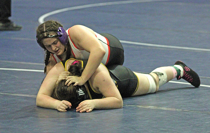 GMLOS’ Kloe Meyer works top position in her Section 2 235-pounds finals match with Apple Valley’s Mila Carnahan. Meyer lost the match but made state as section runner-up. Photo by Paul Trende