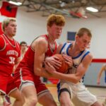 Mabel-Canton’s Nolan Garness battles Houston’s Tilden Witt for a loose ball in the Cougars’ 70-49 win. M-C wrapped up the season with a pair of wins (the other over SEC-East champ Lanesboro). Russ Larson’s group is 18-8 and the win total is the most in Mabel since 1976-1977! Photo by Emma Geiwitz