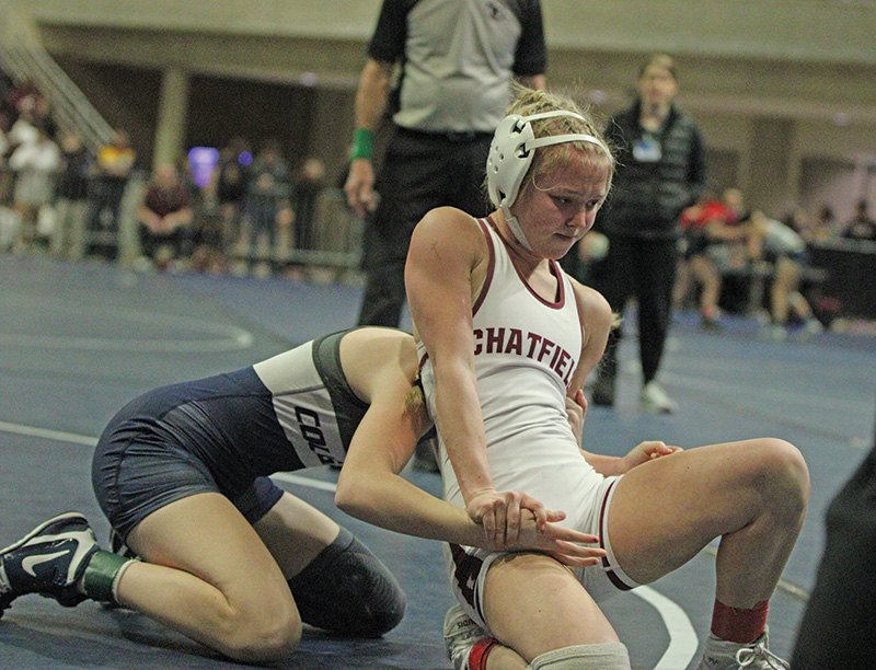 Chatfield’s Maizee Priebe battles Zumbrota-Mazeppa’s Macy Schaefer in a Section 1 112-pound finals match. Schaefer won the bout, but Priebe earned a state berth as runner-up. Photo by Paul Trende