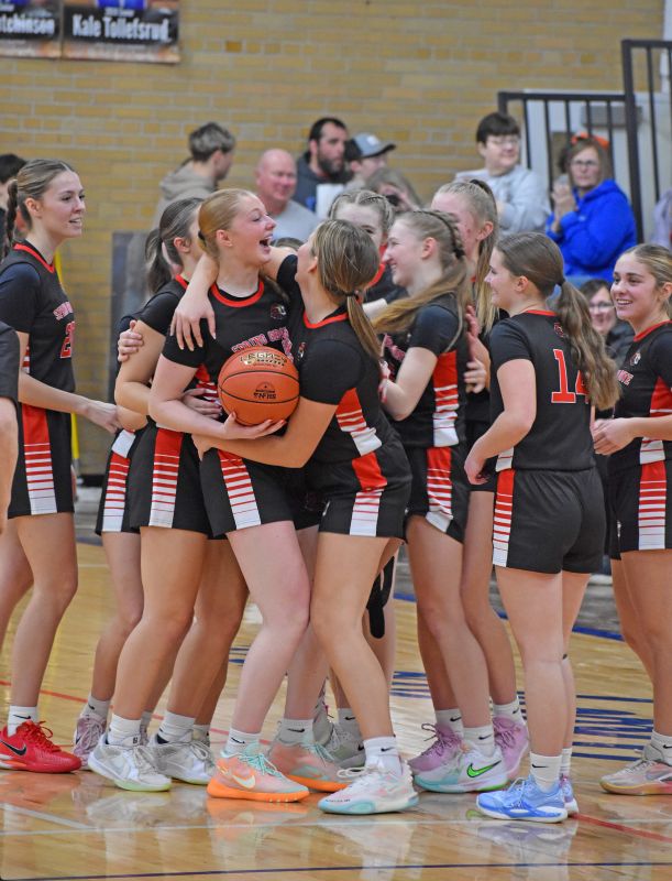 Kinley Soiney celebrates with teammates after securing her 1,021st career rebound in a game with Houston, thus setting the Mabel-Canton girls record breaking the former mark set by Molly Horihan. Soiney is already the school’s all-time leading female scorer. Photo by Heather Kleiboer