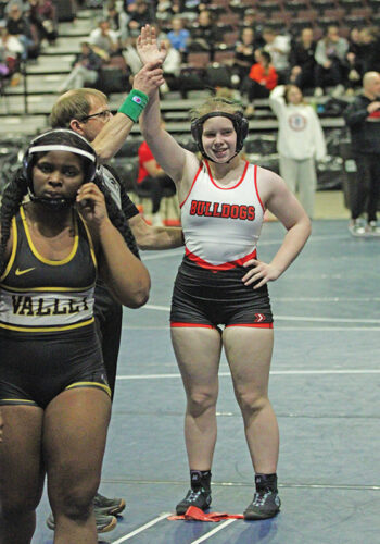 GMLOS’ Willow Dewey gets her hand raised after winning a Section 2 148-pound true second match and clinching a berth at the state tournament. Photo by Paul Trende