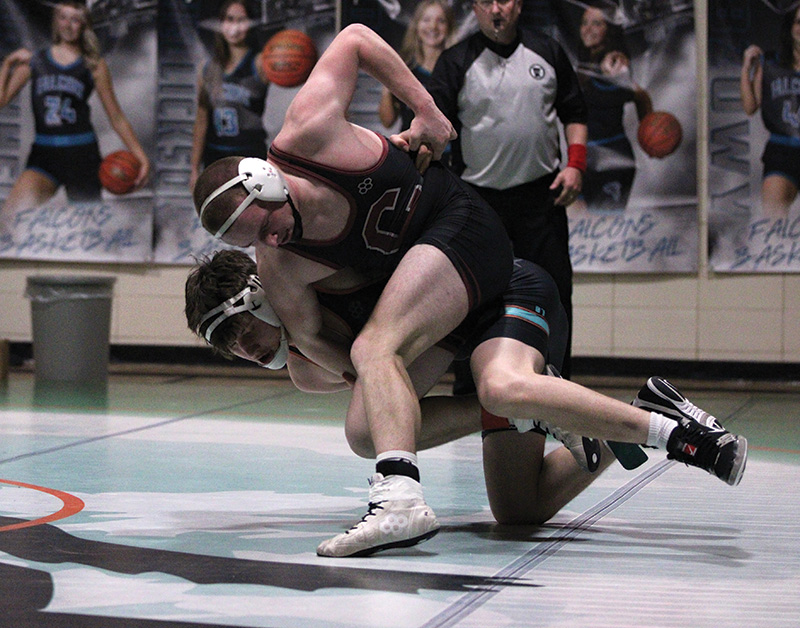 FCLMC’s Ashton Newman tries to get Chatfield’s Hunter Polikowsky off-balanced in a 152-pound match. Polikowsky picked up the win by tech fall, the 100th of the sophomore’s career, and the Gophers won the dual 52-15 to clinch a share of the TRC wrestling title with PEM. Photo by Paul Trende