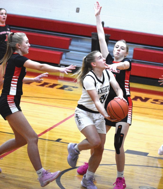 Spring Grove/Mabel-Canton’s Lauren Hammel looks to defend the shot of Kingsland’s Lydia Redman in the Lions’ 70-42 SEC win. SG/M-C (8-1, 13-3) narrowly leads the SEC over Southland (7-1, 13-2) and Lanesboro (7-1, 12-6). Photo b Lee Epps