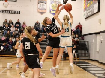 Kingsland’s Hailee Warren looks to block the shot of Fillmore Central’s Hannah Vaalemoen in the Falcons’ 60-28 non-conference win over the Knights. Photo by Christine Vreeman