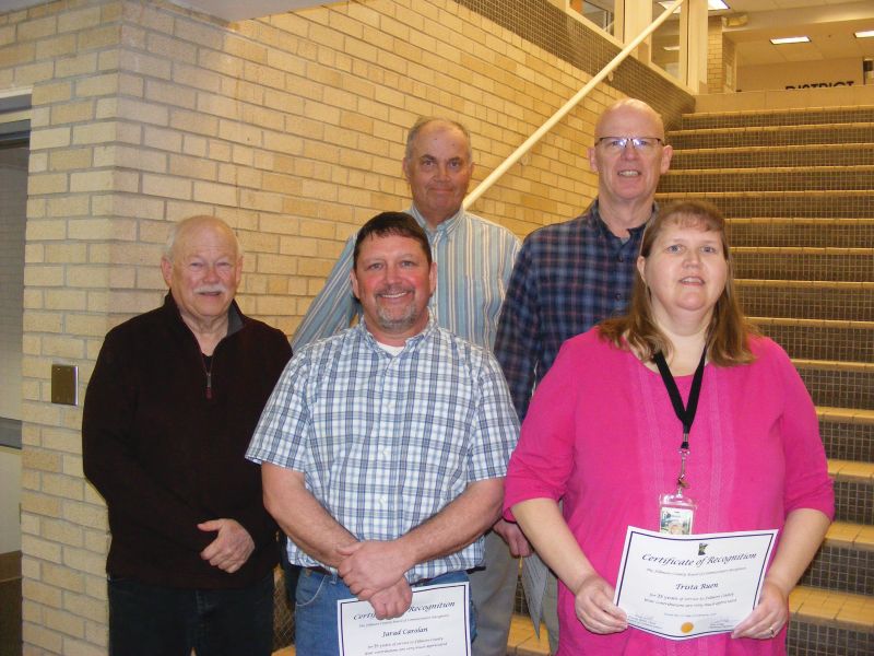 Six individuals were recognized for 25 years of service to the county. Front row Commissioner Randy Dahl, Jarad Carolan (county surveyor assistant), and Trista Ruen (highway shop accounting technician). Back row Commissioner Marc Prestby and Thomas Scheevel (engineering technician senior). Darrell Schmitt (engineering supervisor) is not pictured Photo by Karen Reisner