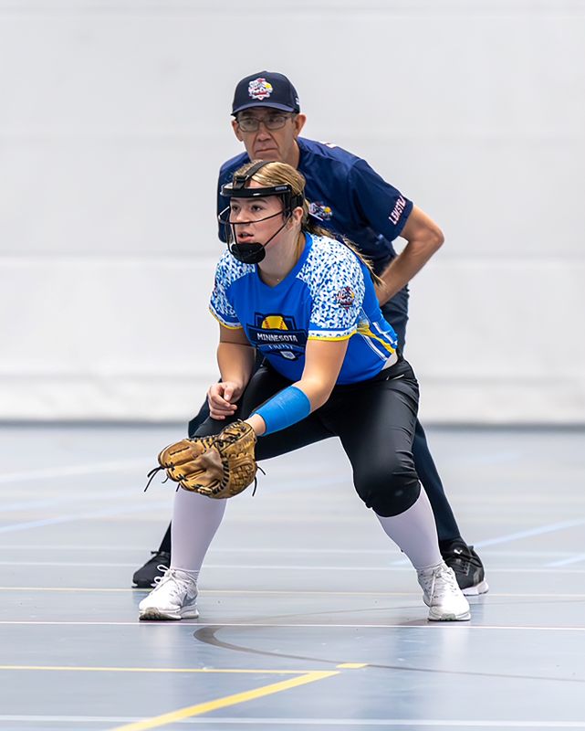 Kylie with the umpire behind her at The Cup games.