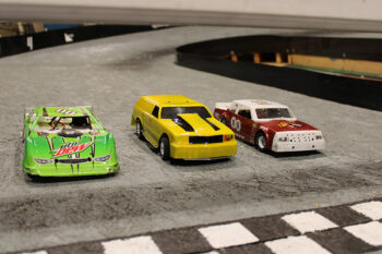 Three of Chris Musty’s RC cars are ready to roll any given Friday night. Photo by Jason Sethre