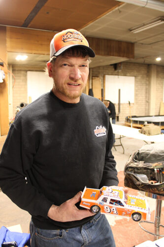 Top finisher Kevin Hager, owner of Hoosier Speedway in Kellogg, Minn., shows his RC car that is a 1/18th scale of his regular size race car. Photo by Jason Sethre