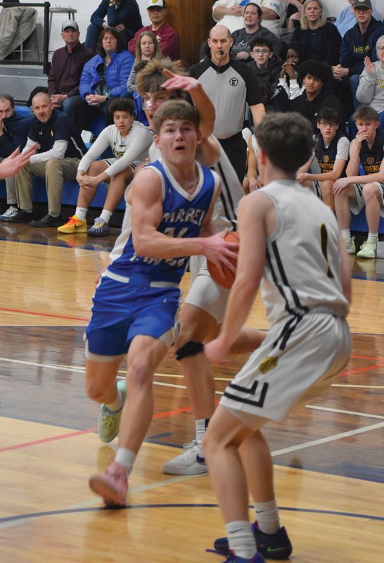 Mabel-Canton’s Kale Eiken gets past a Schaeffer Academy defender and closes in on the hoop in the Cougars’ 70-57 Section 1A Round of 16 contest, earning Russell Larson’s squad their first trip to the section quarterfinals since 2013-2014, which was also their last winning season prior to this year. Photo by Heather Kleiboer