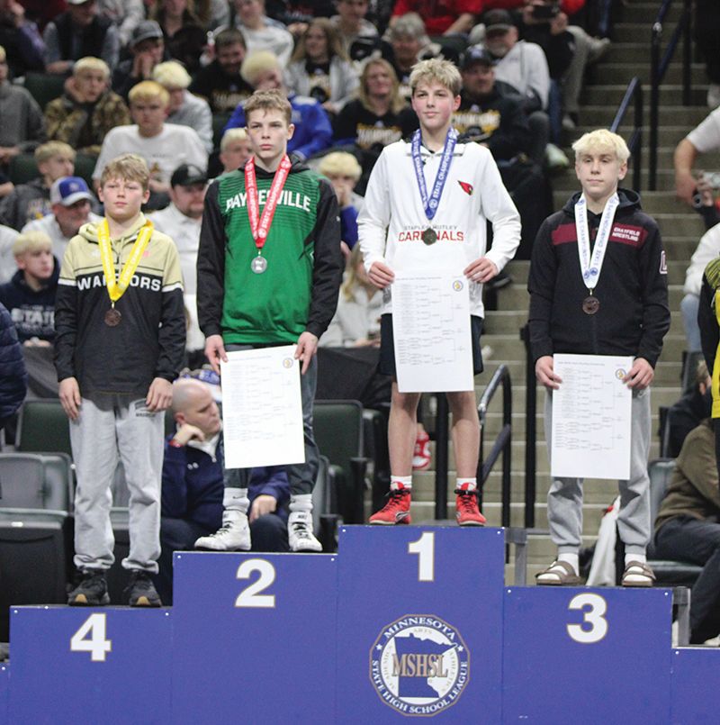 Gracing the state Class A podium at 107-pounds were Caledonia/Houston’s Kiptyn Meiners in fourth place (left) and Chatfield’s Joey Cady (right) in third place. In a section title rematch, Cady beat Meiners by 18-3 tech fall in both athletes last state match. Photo by Paul Trende
