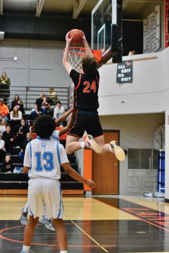 Lanesboro’s Nick Taylor throws it down in the Burros’ 92-49 Section 1A Round of 16 win over Rochester Math and Science Academy. The junior surpassed 1,000 career points in the game and the win clinched Lanesboro’s boys’ their first trip to Rochester and a section quarterfinal since 2013-2014. Photo by Ron Mayer
