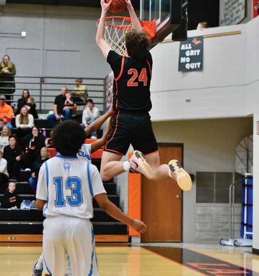 Lanesboro’s Nick Taylor throws it down in the Burros’ 92-49 Section 1A Round of 16 win over Rochester Math and Science Academy. The junior surpassed 1,000 career points in the game and the win clinched Lanesboro’s boys’ their first trip to Rochester and a section quarterfinal since 2013-2014. Photo by Ron Mayer