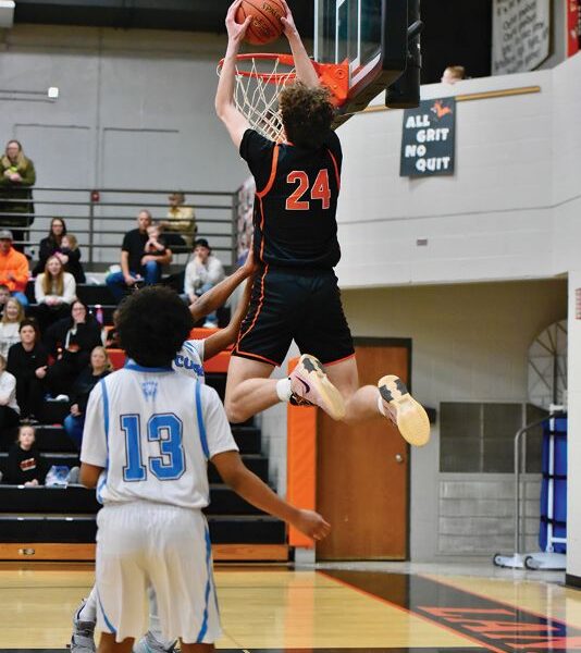 Lanesboro’s Nick Taylor throws it down in the Burros’ 92-49 Section 1A Round of 16 win over Rochester Math and Science Academy. The junior surpassed 1,000 career points in the game and the win clinched Lanesboro’s boys’ their first trip to Rochester and a section quarterfinal since 2013-2014. Photo by Ron Mayer