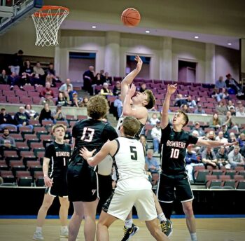 Caledonia’s Aaron Stemper releases a shot in the lane versus Cannon Falls in the Warriors 61-58 1AA quarterfinals win. Cal avenged an 18-point regular season loss to the Bombers. Photo by Craig Johnson