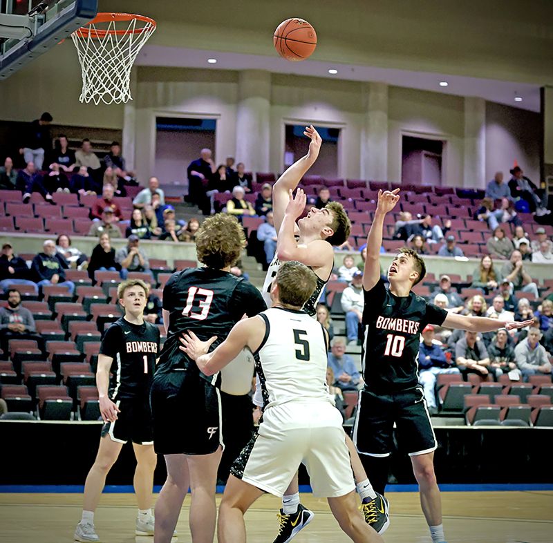 Caledonia’s Aaron Stemper releases a shot in the lane versus Cannon Falls in the Warriors 61-58 1AA quarterfinals win. Cal avenged an 18-point regular season loss to the Bombers. Photo by Craig Johnson