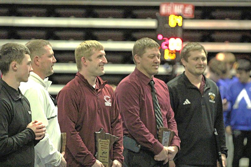 At the individual tourney on February 21, Chatfield head wrestling coach Matt Mauseth (third from left) was honored as Section 1A Coach of the Year. Mauseth and the rest of his Gopher coaches have guided the Gophers to three straight Class A finals matches, while producing 32 total state entrants in the span (25 guys, seven girls). Photo by Paul Trende