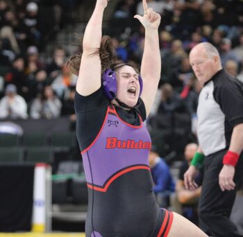 GMLOS’ Kloe Meyer celebrates her ‘blood round’ win over St. Michael/Albertville’s Bindee Nyandibo. Meyer was the only of nine Bulldog state competitors to place, as she took sixth at 235-pounds. Photo by Paul Trende