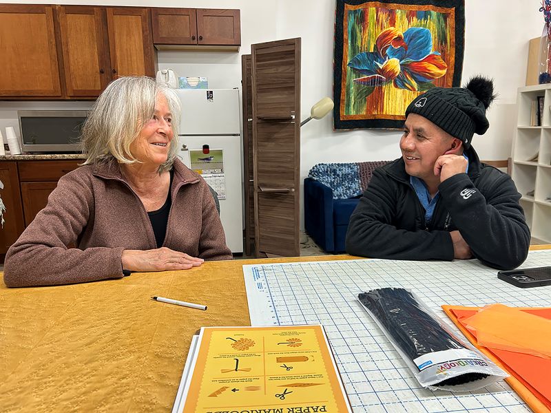 Bonnie Gibson and Roberto chat at the opening reception. Photo by Wanda Hanson