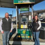 Jordan Brand, owner of Pam’s, and Kelsy Anderson, vice president of R-P Booster Club, at the designated Trojan pump. Photo by Wanda Hanson