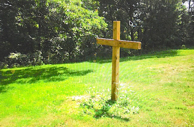 How many Bradys were buried near a wooden cross? This 2007 wooden grave marker replaced an earlier cross, bearing painted-on family names, which eventually weathered beyond repair in St. Patrick’s Catholic Cemetery in Jefferson Township, Houston County, where due to poverty and the passage time, most graves remain unmarked. Photo courtesy of local historian Barbara Scottston 