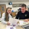 R-P/H Track Coaches Megan LaFleur and Dave Jewison plan for future meets. Photo by Wanda Hanson