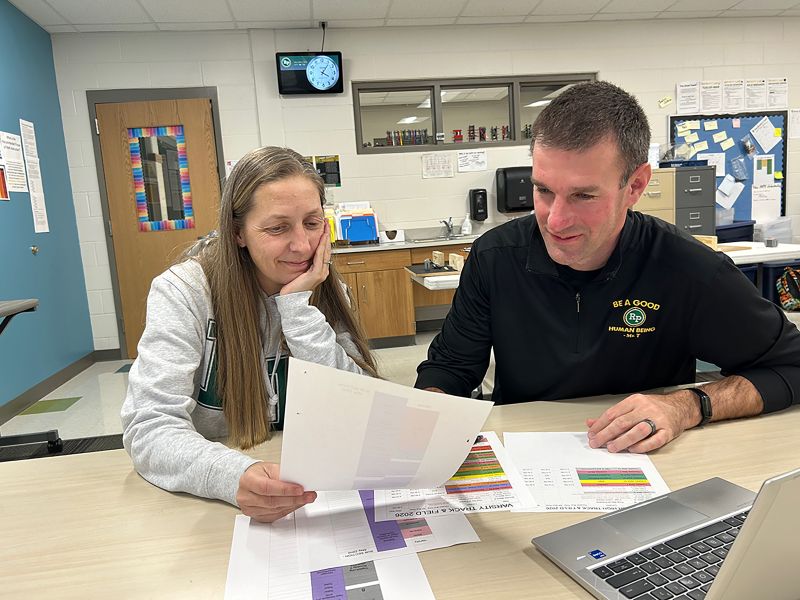R-P/H Track Coaches Megan LaFleur and Dave Jewison plan for future meets. Photo by Wanda Hanson
