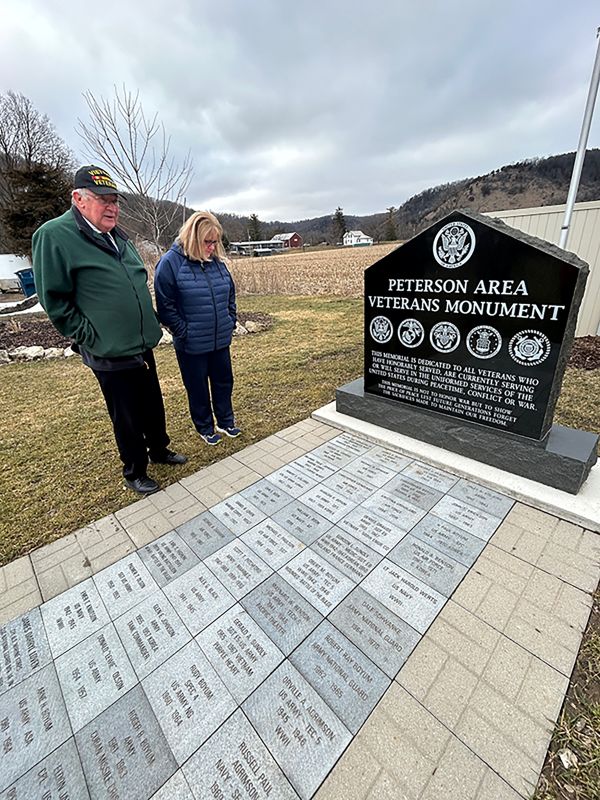 Jeff Zondlo and Sonja Stevens gaze at Wes’ paver at the Veterans Memorial Park in Peterson. Photo by Wanda Hanson