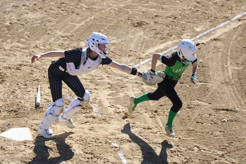 Caledonia catcher Adrienne Lange tags out La Crescent/Hokah’s Ella Gates after a dropped third strike in the Warriors 11-1 win in five innings. Team Cal went 3-0 on the week, also beating Winona High 5-2 and TRC-West leading St Charles 14-1 in five innings, as the Warriors (4-0, 7-1) lead the TRC-East. Photo by Paul Trende