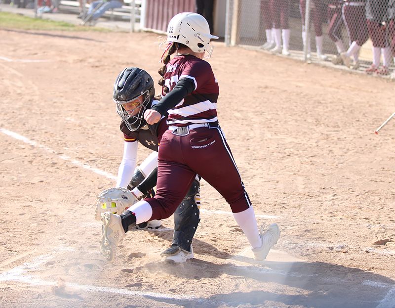 Chatfield’s Rylee Urban gets to home plate just ahead of the throw to Dover-Eyota catcher Nora Hansen. It was the game’s first run, as the Gophers built a 5-0 lead. They held on by a 5-4 final, recording the final out via a strike-three fouled-bunt attempt (with an Eagle runner on third). Photo by Paul Trende