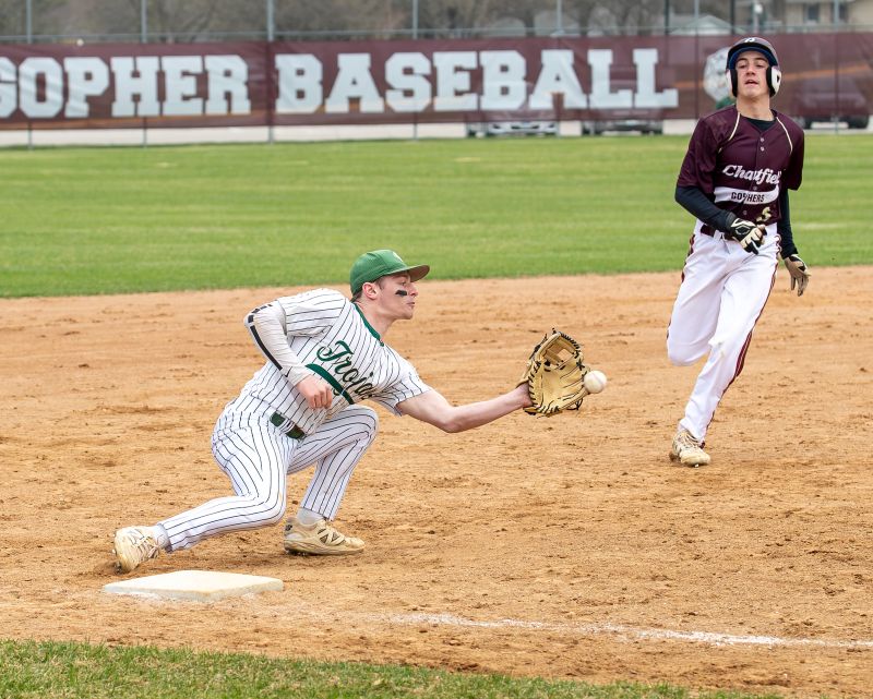 Rushford-Peterson’s Owen Lange receives the throw from home to catch Chatfield runner Kaiden Brenna from stealing third base in the Trojans' 12-3 TRC win, culminating a 3-1 week for R-P. Photo by Leif Erickson