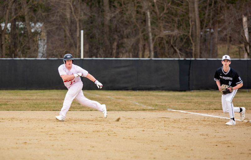 Houston’s Coltin Groth takes his lead away from first base in the Hurricanes’ season-opening game with Blooming Prairie. A spackling of baseball and softball games have been played including above, where the Blossoms won 8-4. Photo by Emma Geiwitz