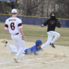 Mabel-Canton’s Brevyn Tollefsrud slides into first safely as the ball comes toward Spring Grove’s Weston Ingvalson in the Cougars’ 6-2 SEC season-opening win. Photo by Lee Epps