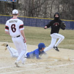 Mabel-Canton’s Brevyn Tollefsrud slides into first safely as the ball comes toward Spring Grove’s Weston Ingvalson in the Cougars’ 6-2 SEC season-opening win. Photo by Lee Epps