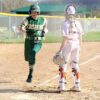 Rushford-Peterson Alannah Skalet scores an early run in the Trojans game with TRC-West leading St. Charles, but the Saints prevailed 11-4. Photo by Craig Johnson