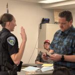 Mayor Jeremy Leis administered the oath of office to Caledonia’s new police officer, Gretchen Braun, at the April 13 council meeting. Photo by Charlene Corson Selbee