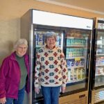 Volunteers Sharon Jahn and Rita Bezdicek show off some of the “cool new additions” at the Spring Valley Area Food Shelf. Photo submitted