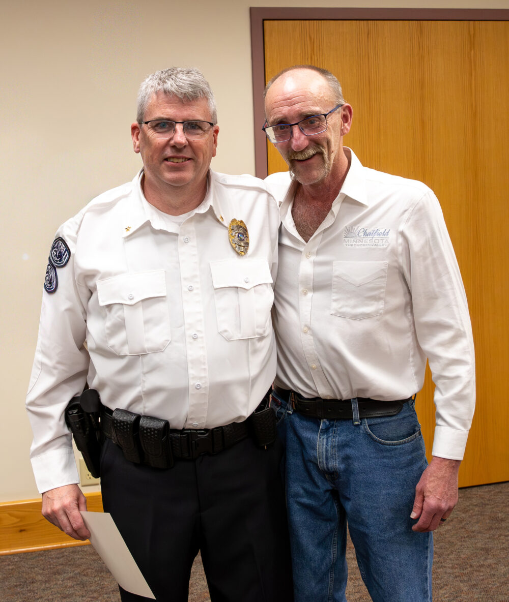 Chatfield Mayor John McBroom welcomes Scott Keigley as police chief. Photo by Leif Erickson